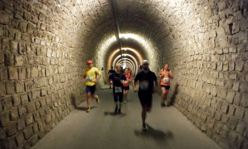 Istrski Maraton, Slovenia - runners in a tunnel of the former Parenzana railway (Copyright © 2019 Hendrik Böttger / runinternational.eu)