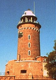 The lighthouse in the harbour of Kołobrzeg, Poland (Author: Dramburg / German Wikipedia Project / Public Domain / image modified by runinternational.eu)
