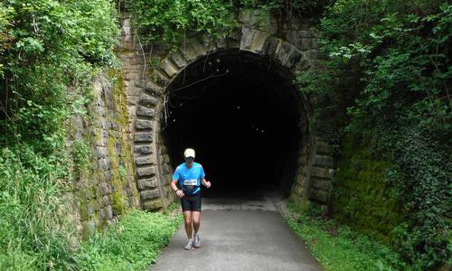 Istrski Maraton - Istrian Marathon - a runner at a railway tunnel of the Parenzana, Slovenia (Copyright © 2016 Hendrik Böttger / runinternational.eu)