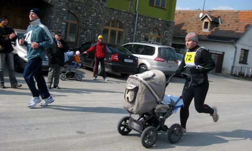 Majcichovská desiatka - a 10k runner runs with a pram through the village of Majcichov in Slovakia (Copyright © 2010 Marta Országhová)